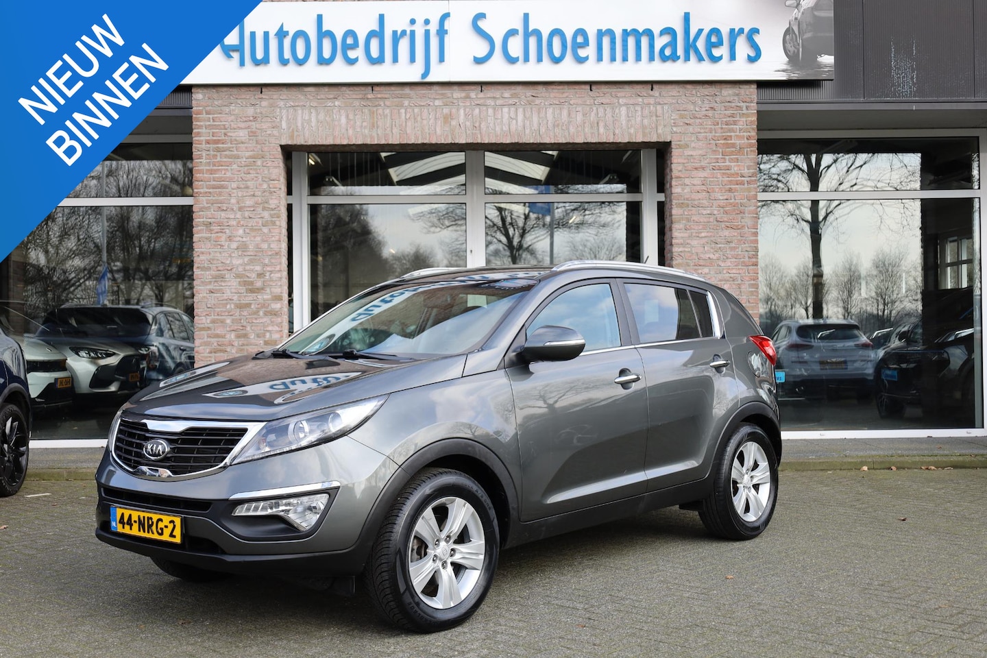 Kia Sportage - 2.0 X-ecutive Plus Pack HALF-LEER CRUISE NAVI CLIMA HILL-HOLD BT-TELEFOONVERB PDC 17''LMV - AutoWereld.nl