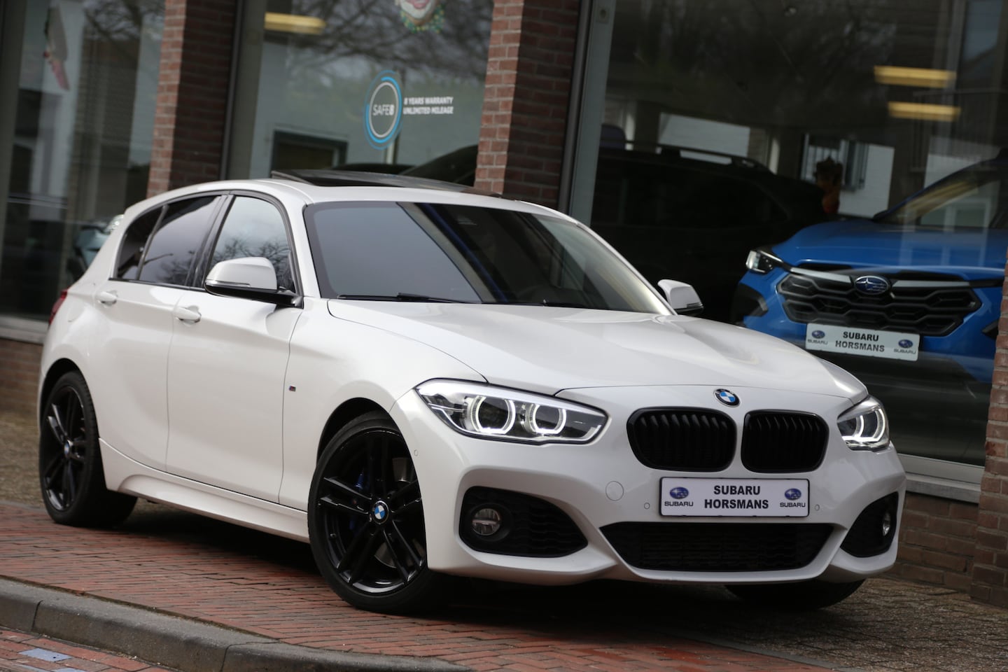 BMW 1-serie - 118i M-Sport High Exec Autom Schuifdak HK Camera Leer Navi LED - AutoWereld.nl