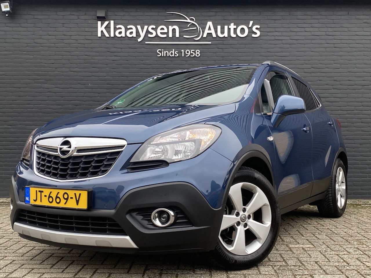 Opel Mokka - 1.4 T Cosmo 140 pk AUT. | dealer onderhouden | leder sportstoelen | navigatie | schuifdak - AutoWereld.nl