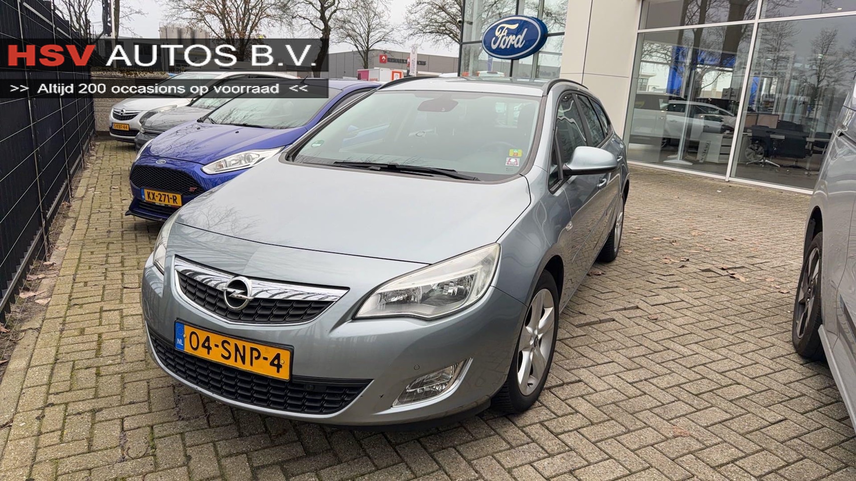 Opel Astra Sports Tourer - 1.4 Turbo Edition navi LM airco cruise - AutoWereld.nl