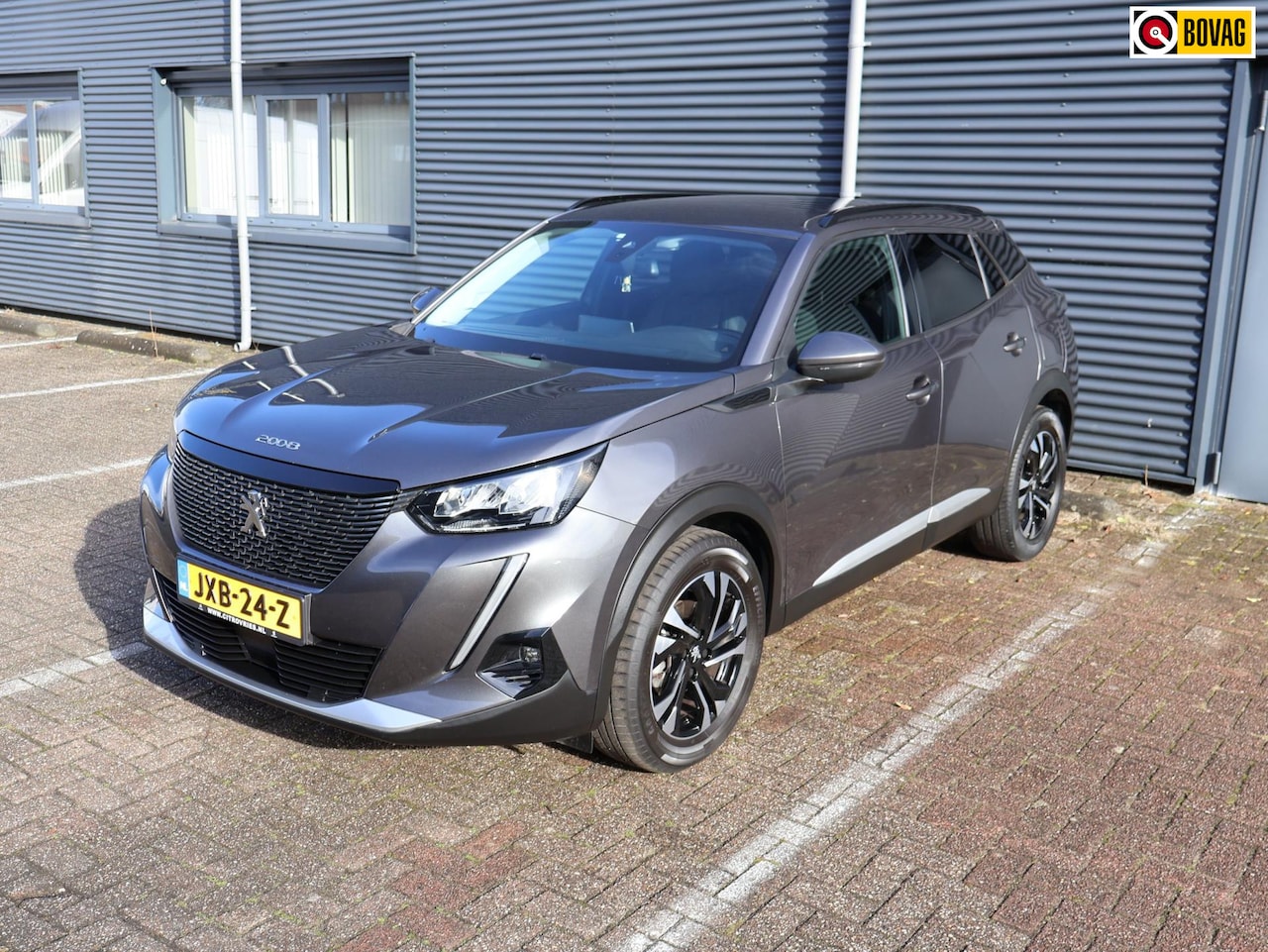 Peugeot 2008 - 1.2 PureTech Allure Pack Navi Dealer Leder PDC Camera APK Garantie - AutoWereld.nl