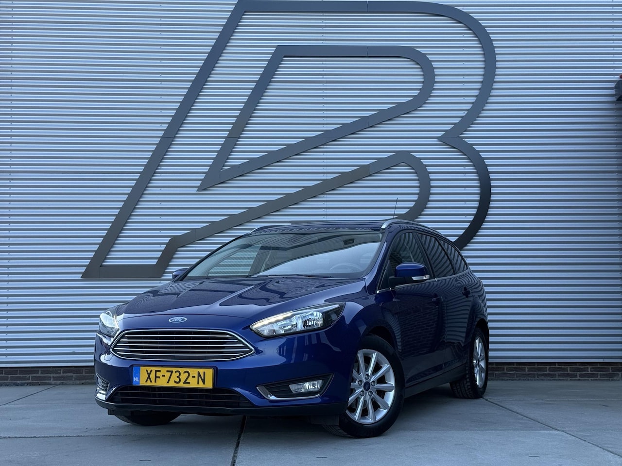 Ford Focus Wagon - 1.0 Titanium 1e Eigenaar|Navi|Trekhaak|Clima|Cruise|Carplay|PDC|APK tot 03-2027 - AutoWereld.nl