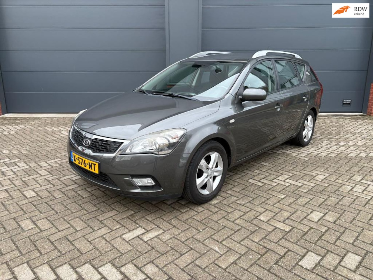 Kia Cee'd Sporty Wagon - 1.4 CVVT X-ecutive 1.4 CVVT X-ecutive - AutoWereld.nl