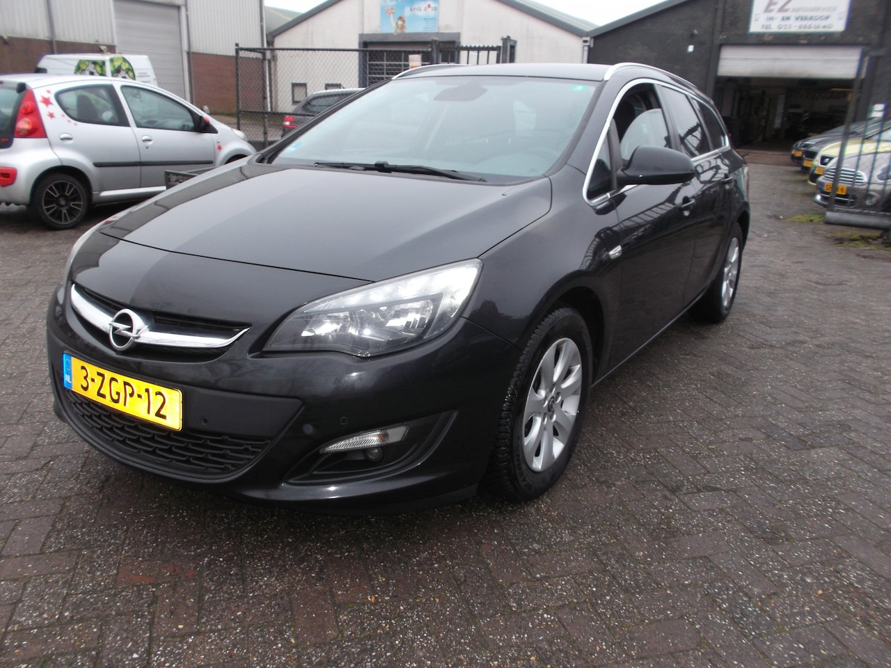 Opel Astra Sports Tourer - 1.4 Turbo Business + airco navi - AutoWereld.nl