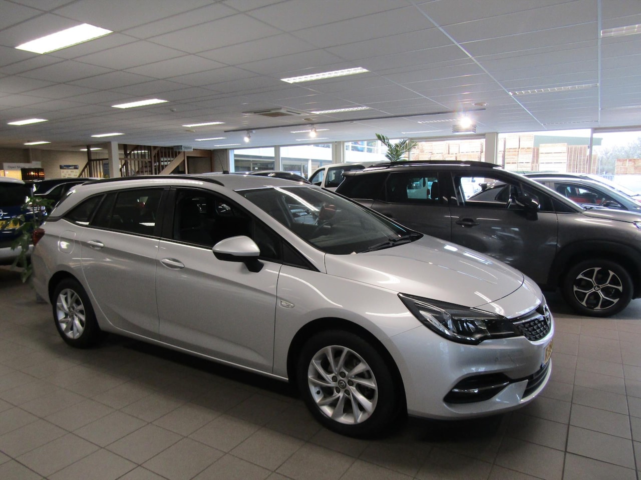 Opel Astra Sports Tourer - 1.2 Turbo 110pk ECC, NAVI, BLUET, L.M. VELG. - AutoWereld.nl