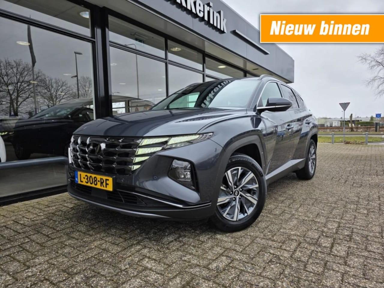 Hyundai Tucson - 1.6 T-GDI HEV COMF SMART ADAPTIEF/TREKHAAK - AutoWereld.nl
