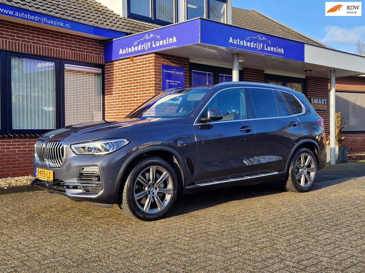BMW X5 - XDrive45e High Executive H&K Panorama Laser El. Trekhaak Head Up Comfortstoelen ACC Warmte - AutoWereld.nl