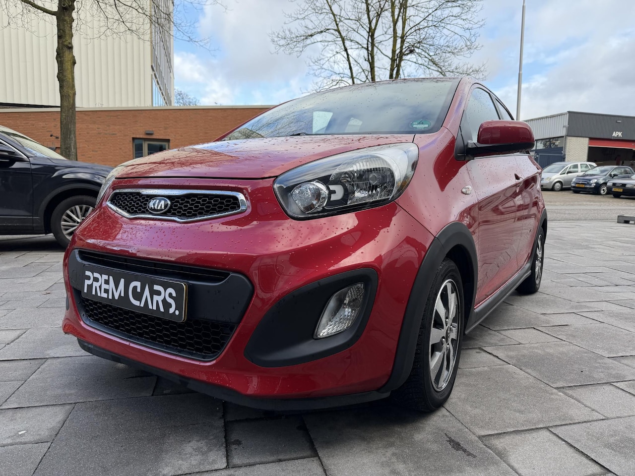 Kia Picanto - 1.2 CVVT ISG R-Cross Signal Red | 76.434 KM - AutoWereld.nl