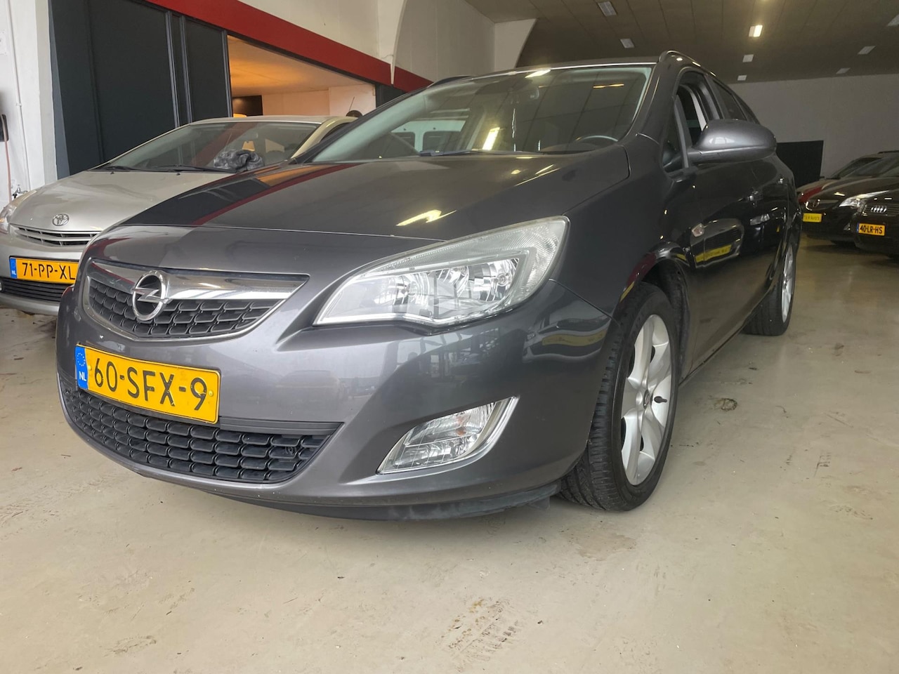 Opel Astra Sports Tourer - 1.4 Turbo Edition navi nette auto - AutoWereld.nl
