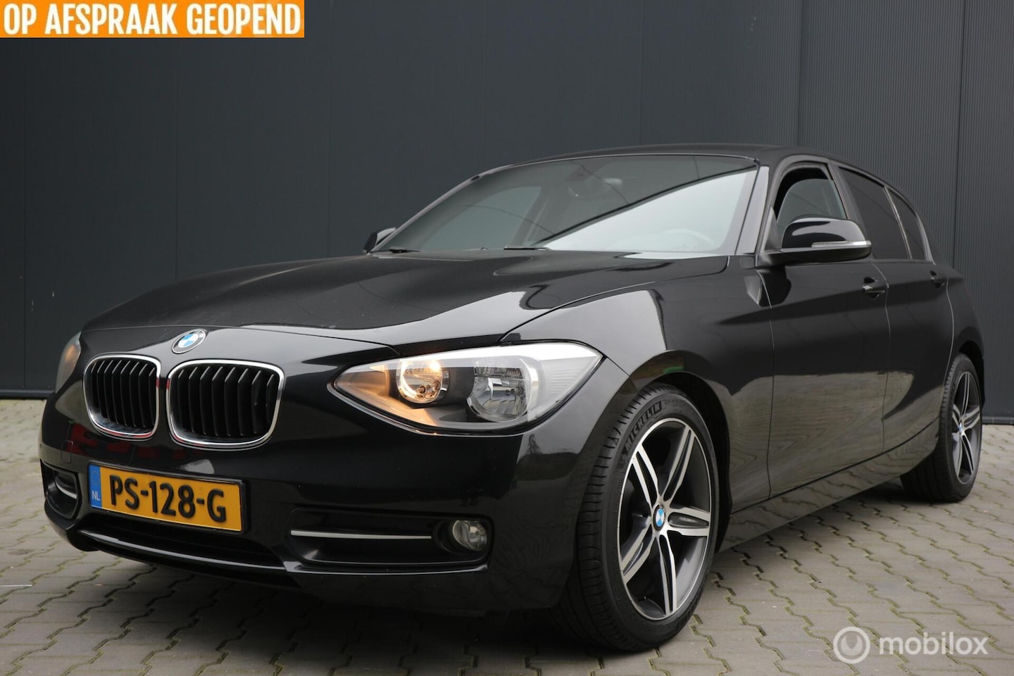 BMW 1-serie - 116i Sport AIRCO-ECC/NAVIGATIE/PDC/TREKHAAK/LMV - AutoWereld.nl