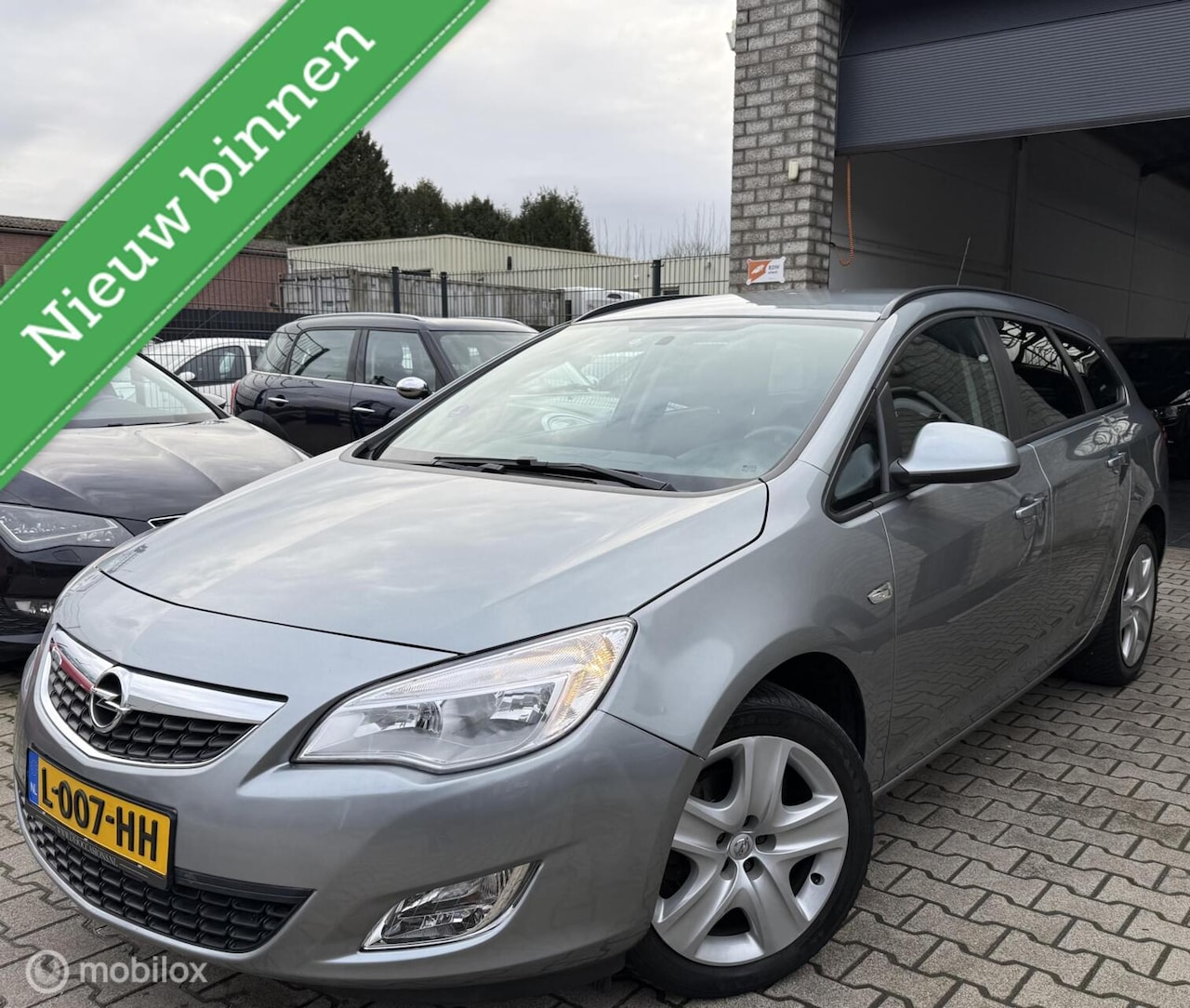 Opel Astra Sports Tourer - 1.4 Edition/65.000KM /Dealer onderh - AutoWereld.nl
