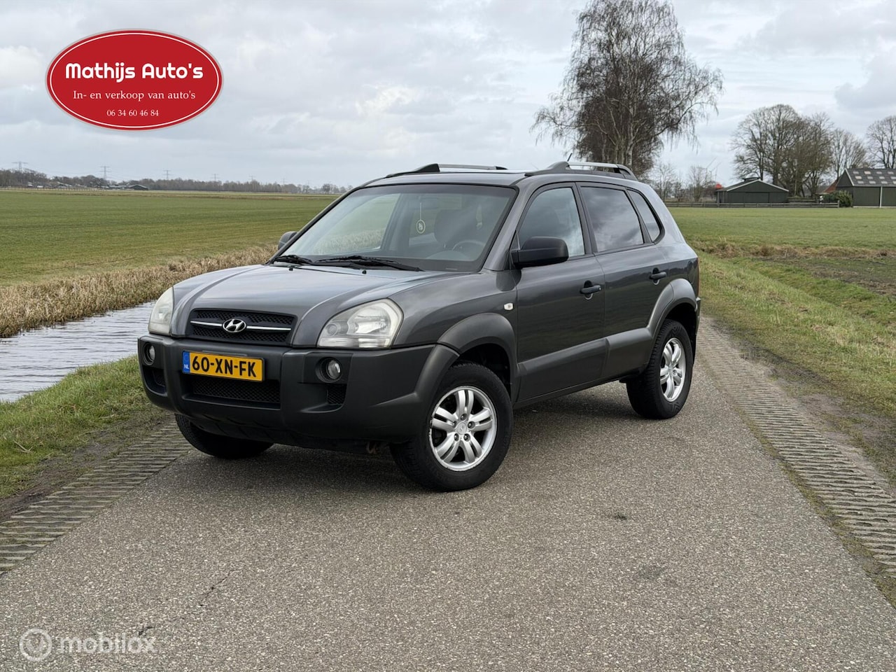 Hyundai Tucson - 2.0i Dynamic Cross Airco Cruise Goed onderhouden! - AutoWereld.nl