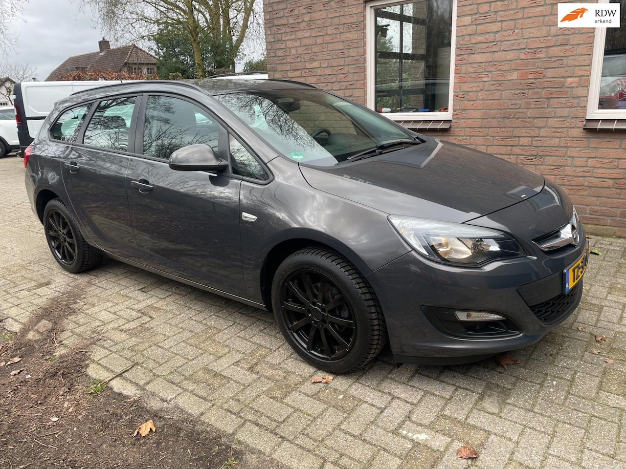 Opel Astra Sports Tourer - 1.4 airco, sportvelgen, perfect onderhouden - AutoWereld.nl