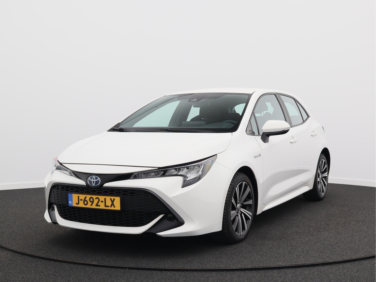 Toyota Corolla - 1.8 Hybrid Active/ lage km/ zeer mooi! - AutoWereld.nl
