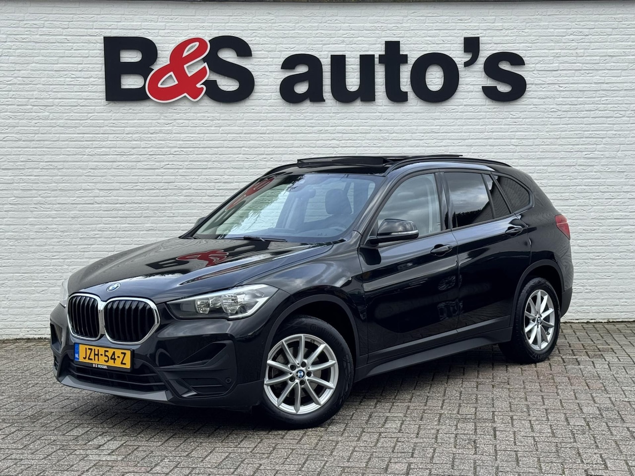 BMW X1 - 1.8d sDrive High Executive Head Up display Climate Cruise Pano Leer Navi PDC voor en achte - AutoWereld.nl