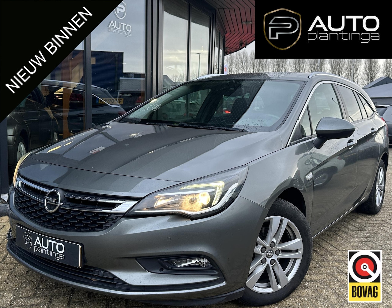 Opel Astra Sports Tourer - 1.4 Turbo 120 Jaar Edition 150PK | AUTOMAAT | ZEER NETTE STAAT | Trekhaak | Stoel en Stuur - AutoWereld.nl