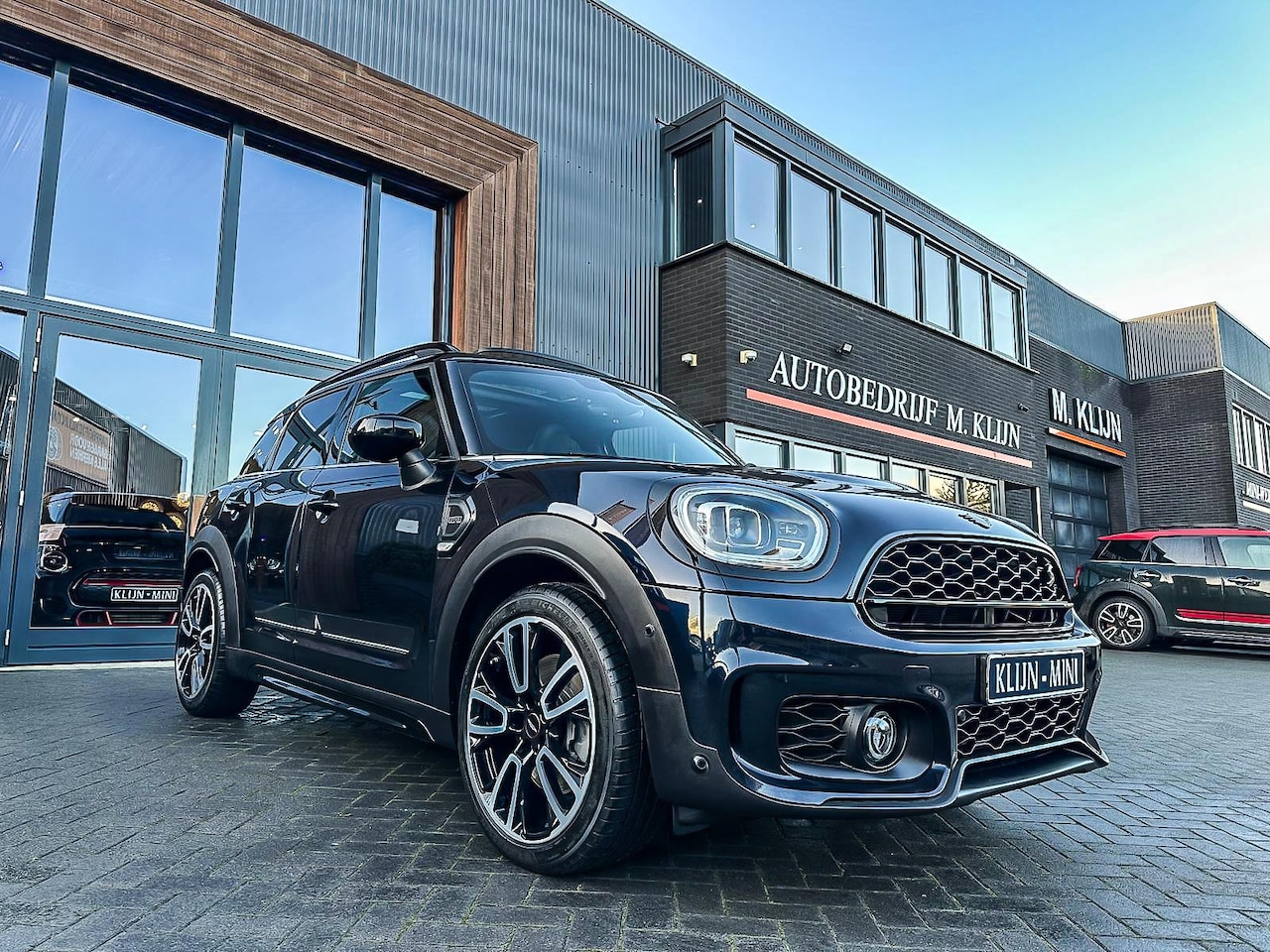 MINI Countryman - Mini 2.0 Cooper S ALL4 John Cooper Works F1 aut/Pano/Camera/Memory/Bomvol - AutoWereld.nl