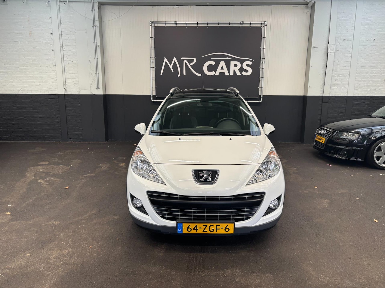 Peugeot 207 SW Outdoor - 1.6 VTi airco eerste eigenaar 59000km - AutoWereld.nl