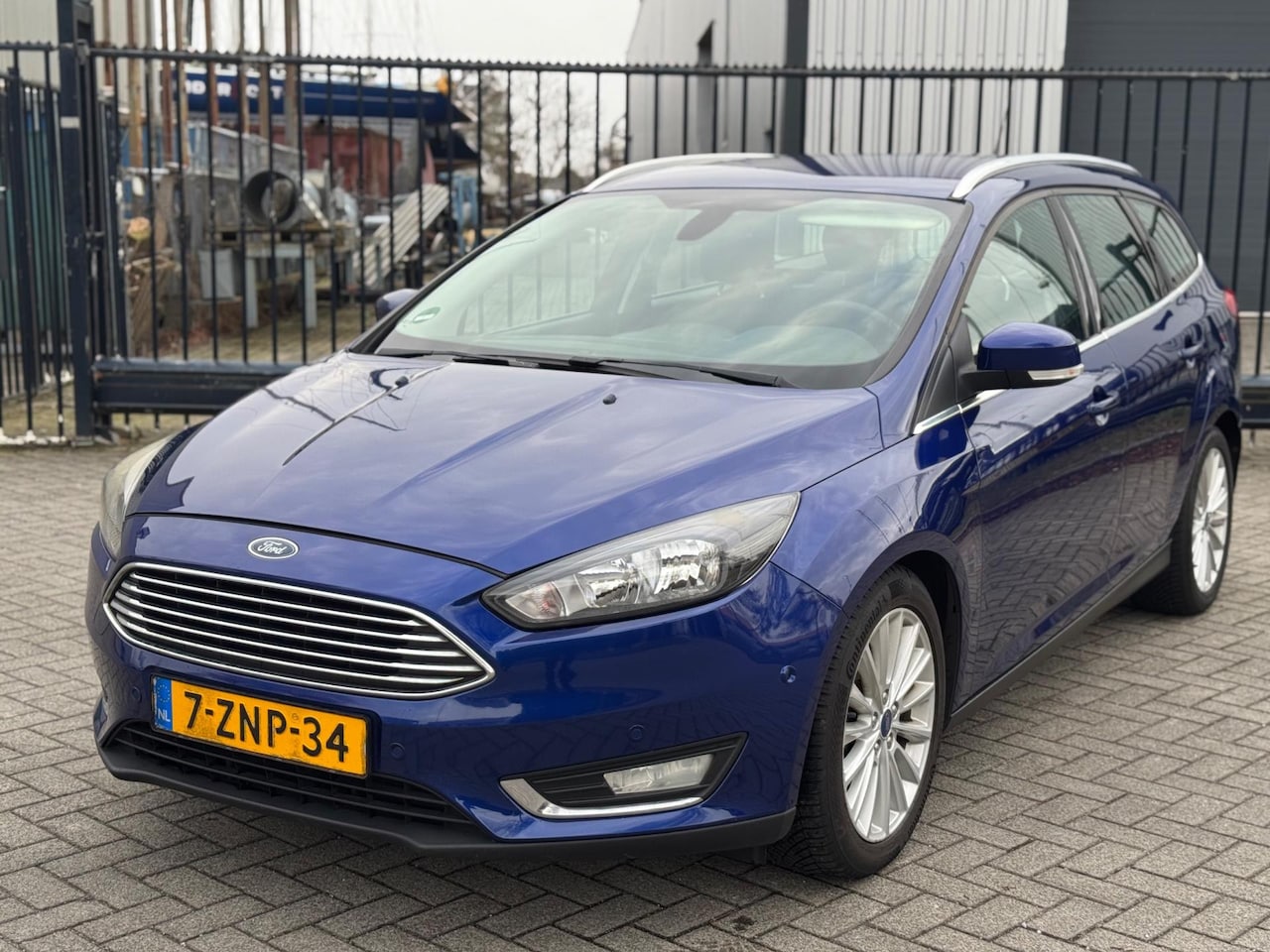 Ford Focus Wagon - 1.5 TDCI Titanium Edition Clima Navi - AutoWereld.nl