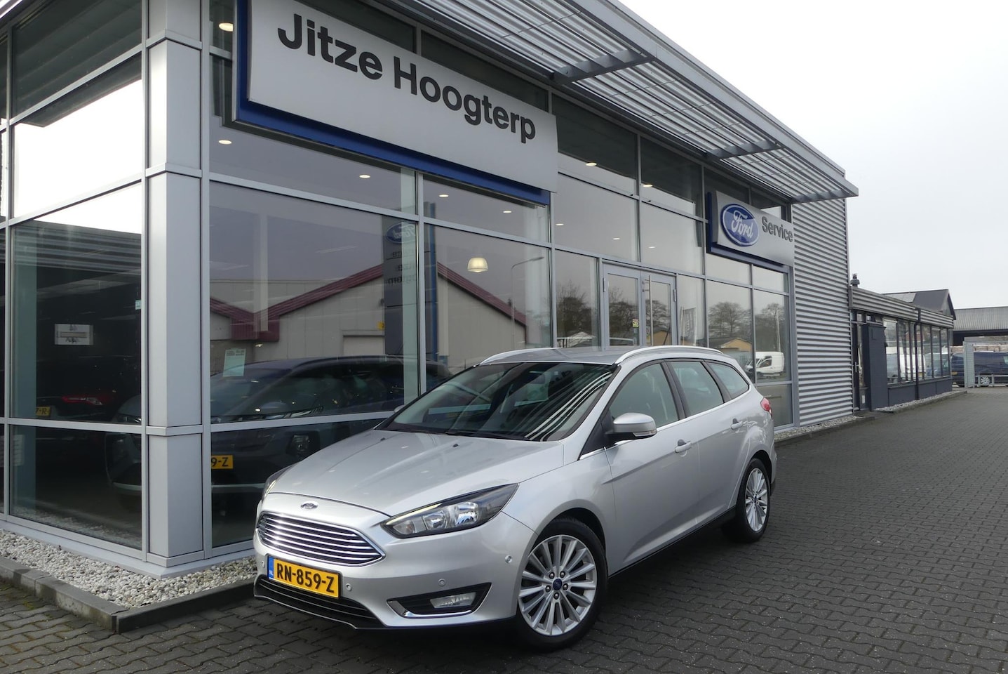 Ford Focus Wagon - 1.0 Titanium CRUISE, CLIMA, NAVI, PDC V&A, APPLE CARPLAY/ANDROID AUTO, KEYLESS, 107.558KM - AutoWereld.nl