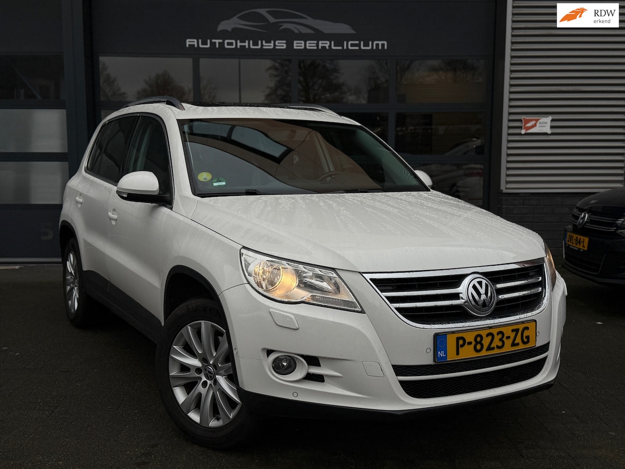 Volkswagen Tiguan - 2.0 TSI Sport&Style 4Motion Pano Trekhaak Bluetooth LMV Dealer onderhouden - AutoWereld.nl