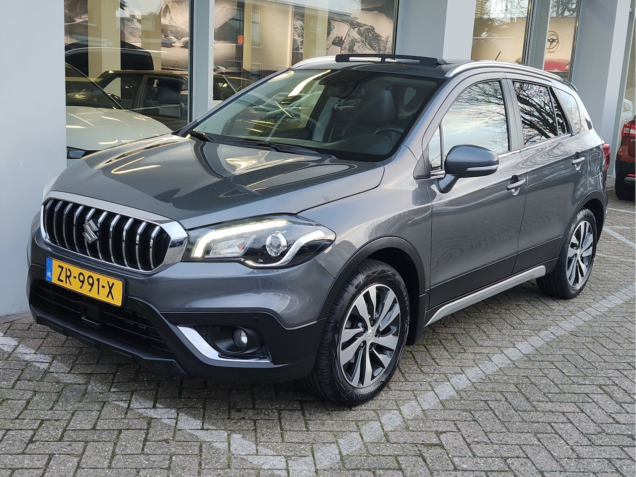 Suzuki S-Cross - 1.0 BOOSTERJET STIJL Open dak | Leder | Adaptive Cruise | Camera - AutoWereld.nl