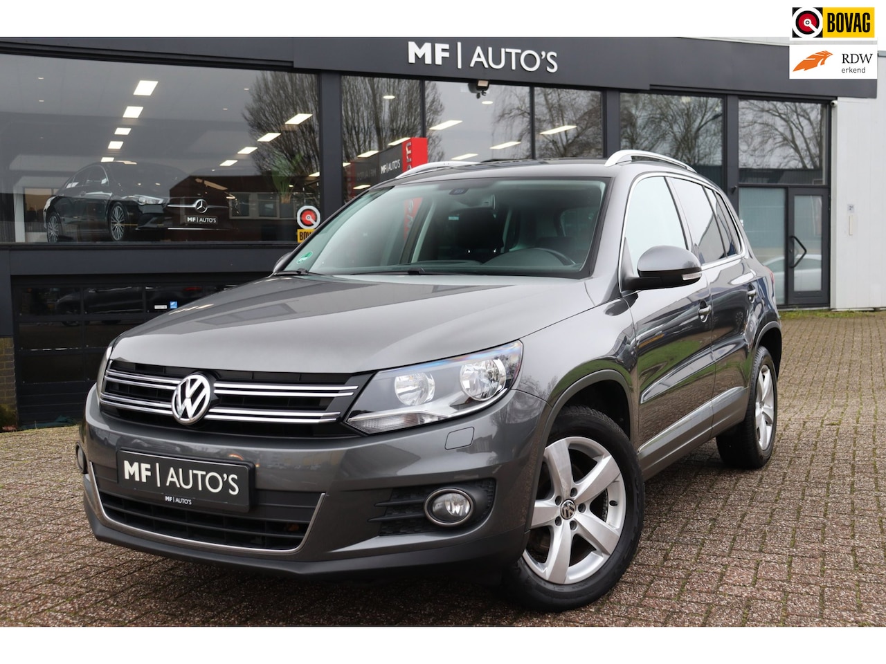 Volkswagen Tiguan - 1.4 TSI Sport&Style|Navi|Stoelvw|Clima|PDC|Cruise - AutoWereld.nl