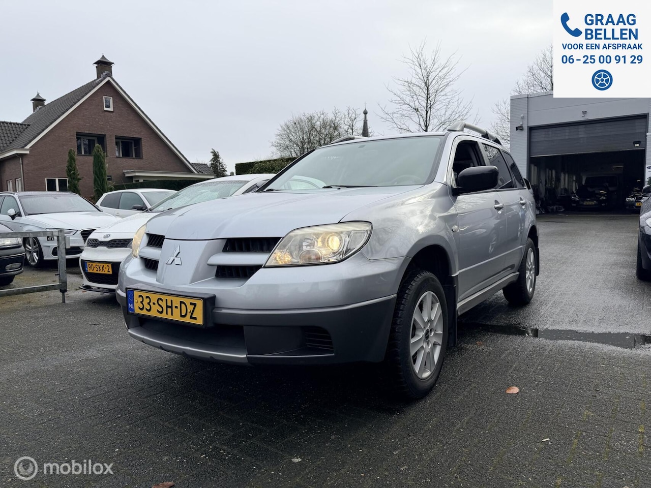 Mitsubishi Outlander - 2.0 Invite plus LM / PDC / Trekhaak / Parrot - AutoWereld.nl
