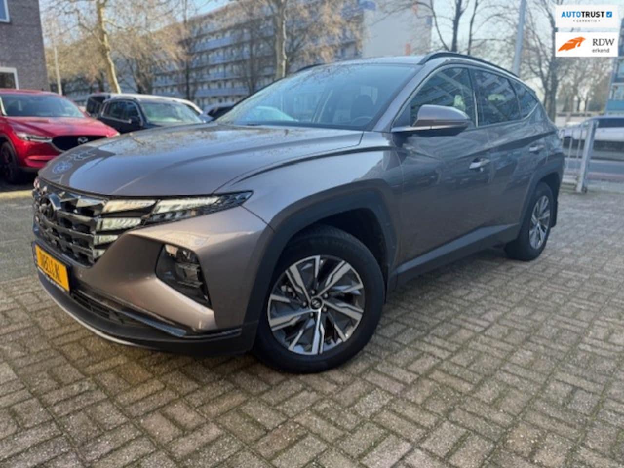 Hyundai Tucson - 1.6 T-GDI HEV 235 PK i-Motion Navi/Carplay/Camera/Trekh - AutoWereld.nl