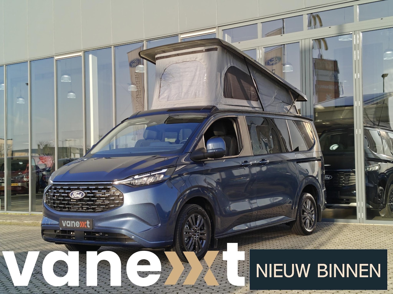 Ford Model T - Custom Vanexxt 340 L1H1 2.5 PHEV Titanium Plus | REIMO HEFDAK | 4 SLAAPPLAATSEN | ZIJKEUKE - AutoWereld.nl