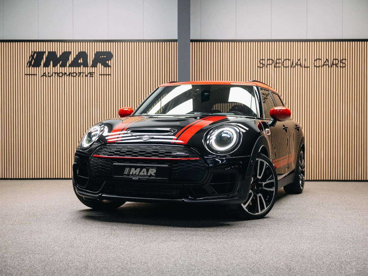 MINI Clubman - 2.0 JCW ALL4 John Cooper Works | JCW | Rood dak | Sportstoelen | Stoelverwarming | Head-Up - AutoWereld.nl
