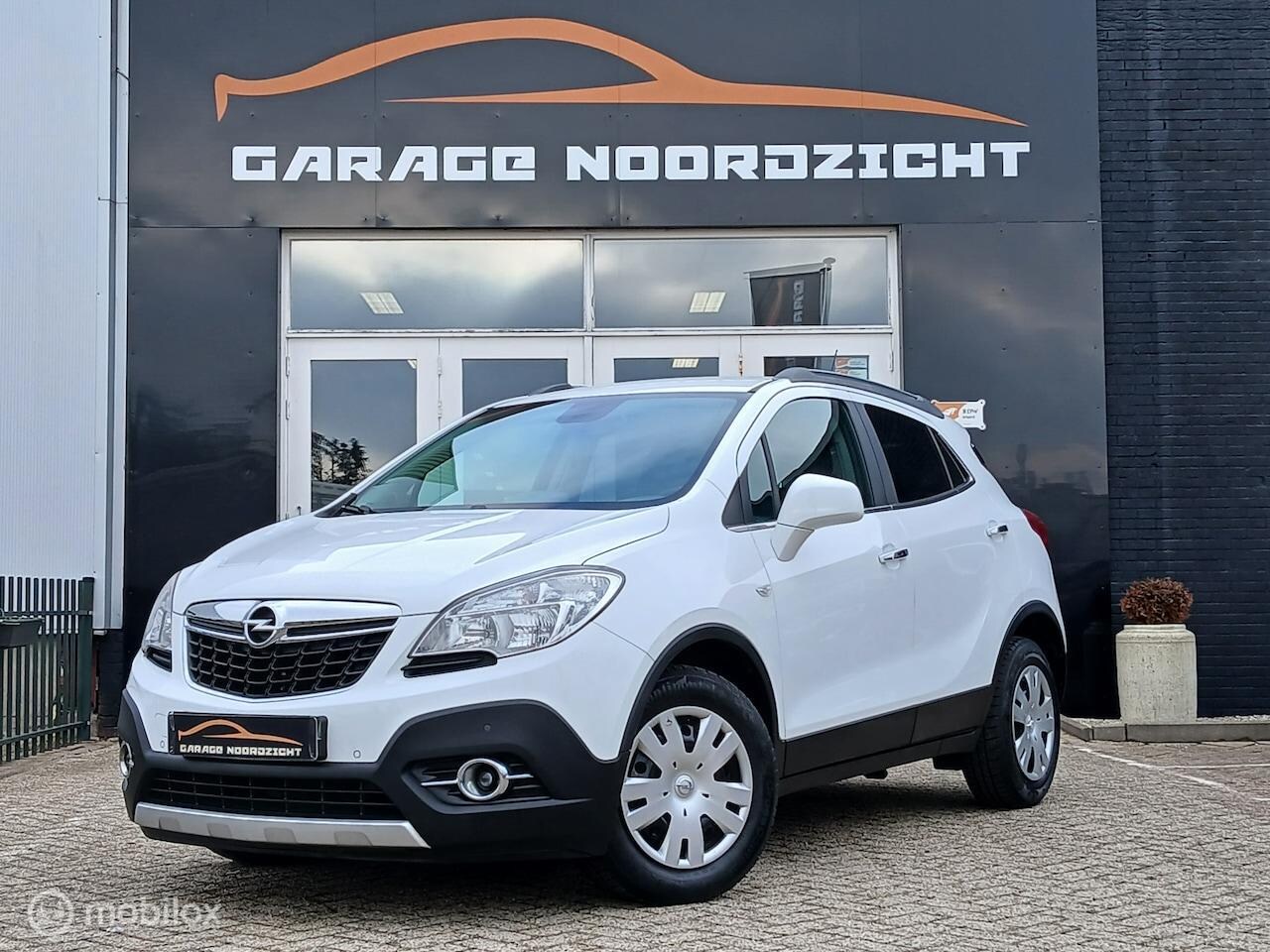 Opel Mokka - 1.6 Cosmo Navigatie|Bluetooth|Dakrails|Halflederbekledig|PDC|Electrische deur vergrendelin - AutoWereld.nl