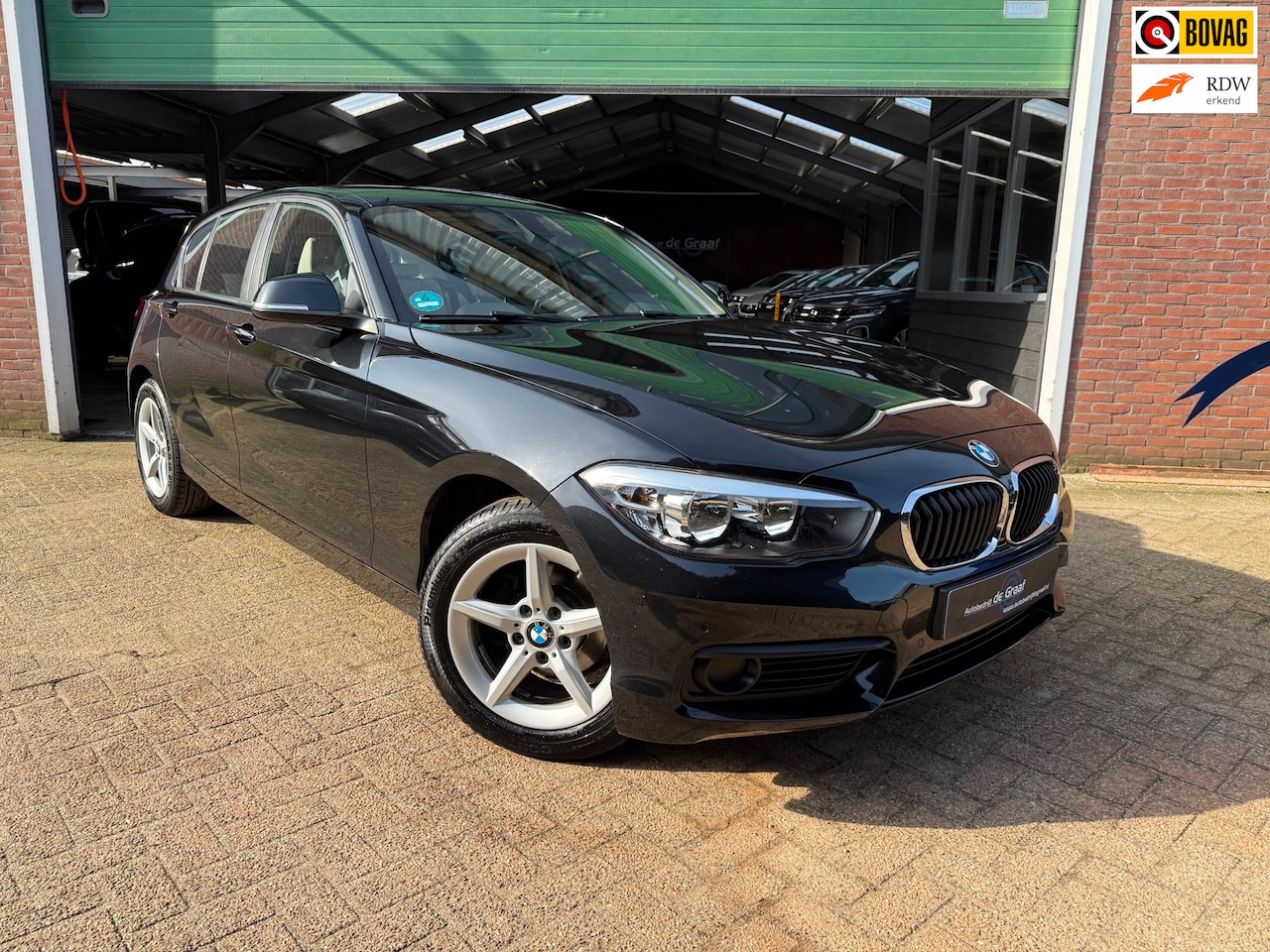BMW 1-serie - 118i Executive|AUTOMAAT/CRUISE/NAVI/LED/LEDER/PDC - AutoWereld.nl