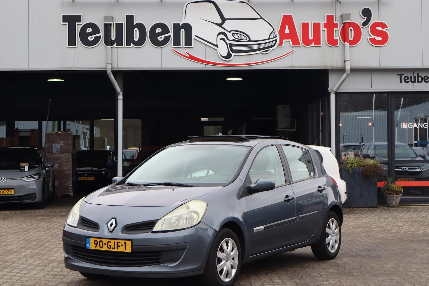 Renault Clio - 1.2 TCE Rip Curl Schuif- kanteldak, Airco, Panoramadak, Elektrische ramen - AutoWereld.nl