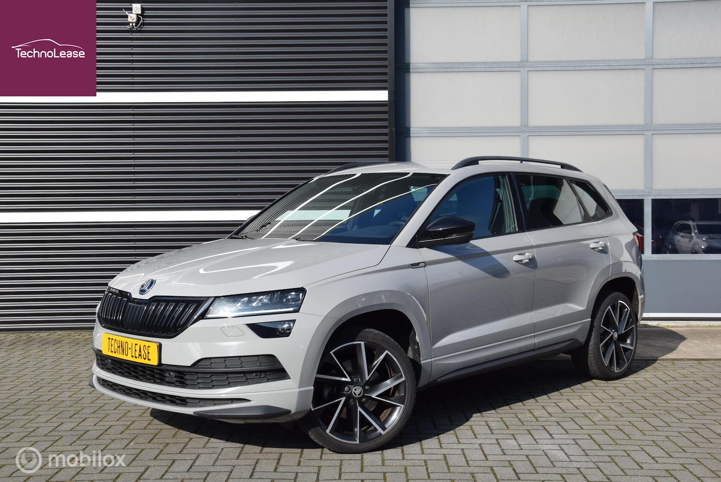 Skoda Karoq - 1.5 TSI 150pk ACT Sportline Business DSG Canton trekhaak - AutoWereld.nl