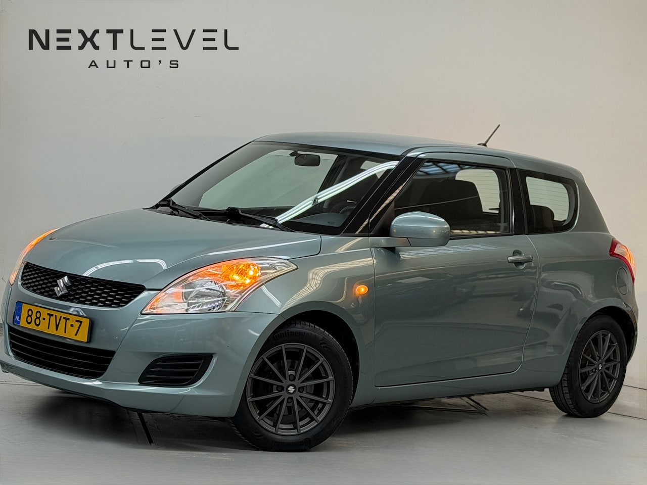 Suzuki Swift - 1.2 Comfort EASSS Airco Stoelverwarming Nieuw APK - AutoWereld.nl