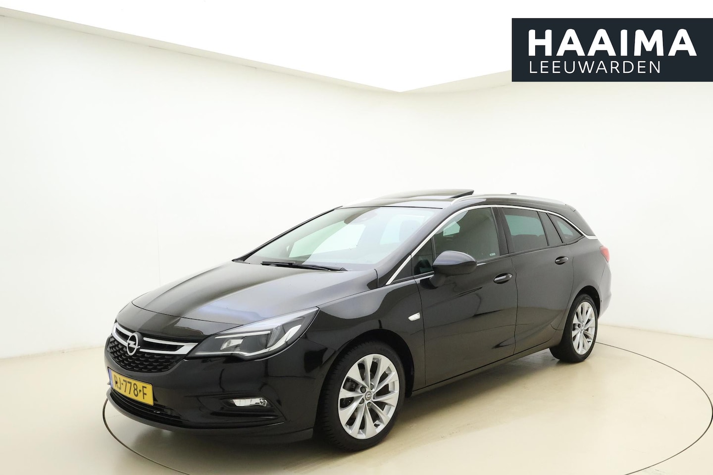 Opel Astra Sports Tourer - 1.0 Business Executive | Navigatie | Schuif kantel dak| Trekhaak | Climate control | Stoel - AutoWereld.nl
