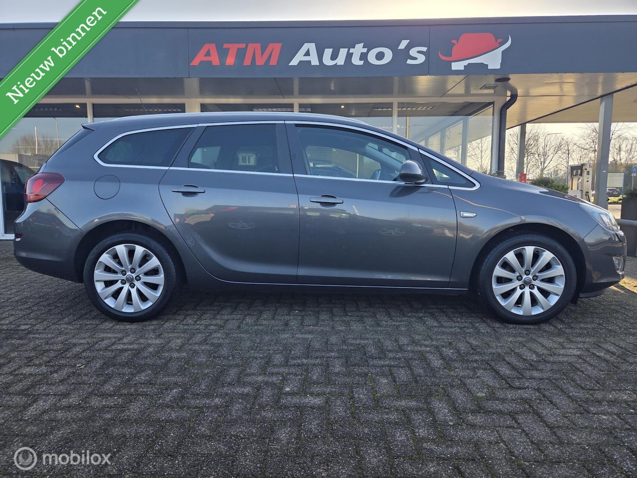 Opel Astra Sports Tourer - 1.4 Turbo Sport Airco Cruise PDC - AutoWereld.nl