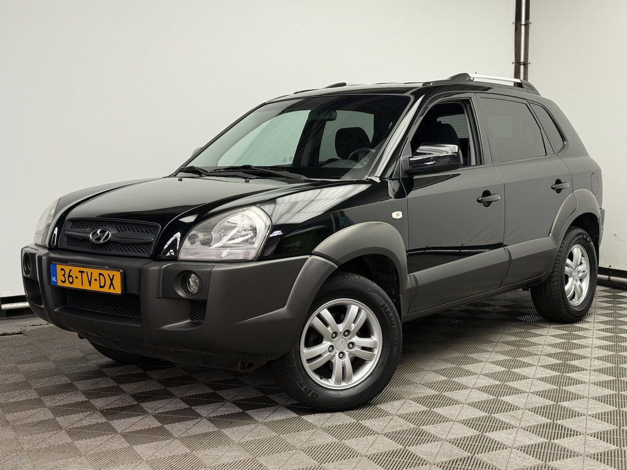 Hyundai Tucson - 2.0i Style Premium Cruise Trekhaak 1e Eigenaar - AutoWereld.nl