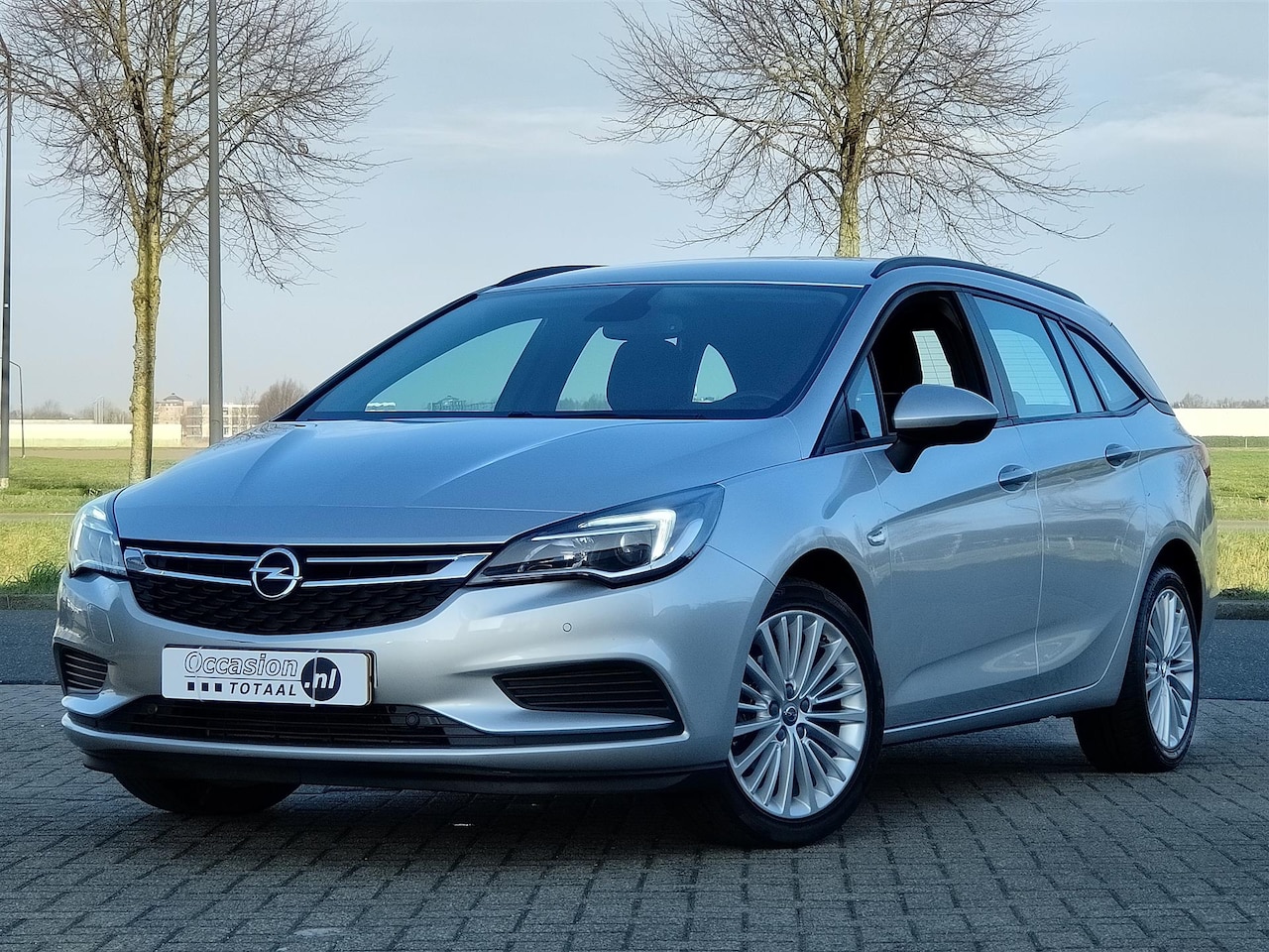Opel Astra Sports Tourer - 1.4 Business+ | Navi | Cruise | PDC - AutoWereld.nl