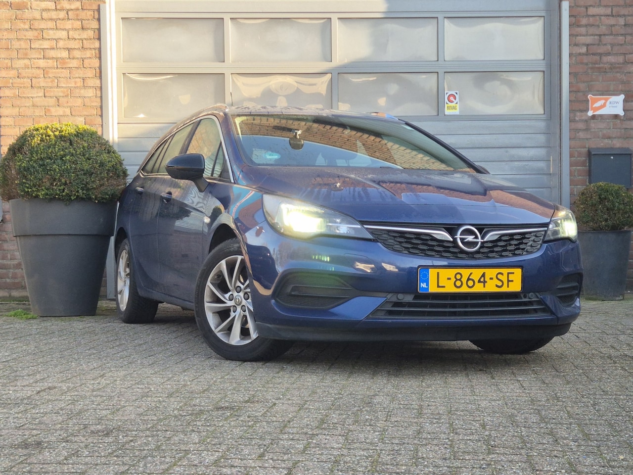 Opel Astra Sports Tourer - 1.2 Business Elegance Stof-Leder/cruise/ - AutoWereld.nl