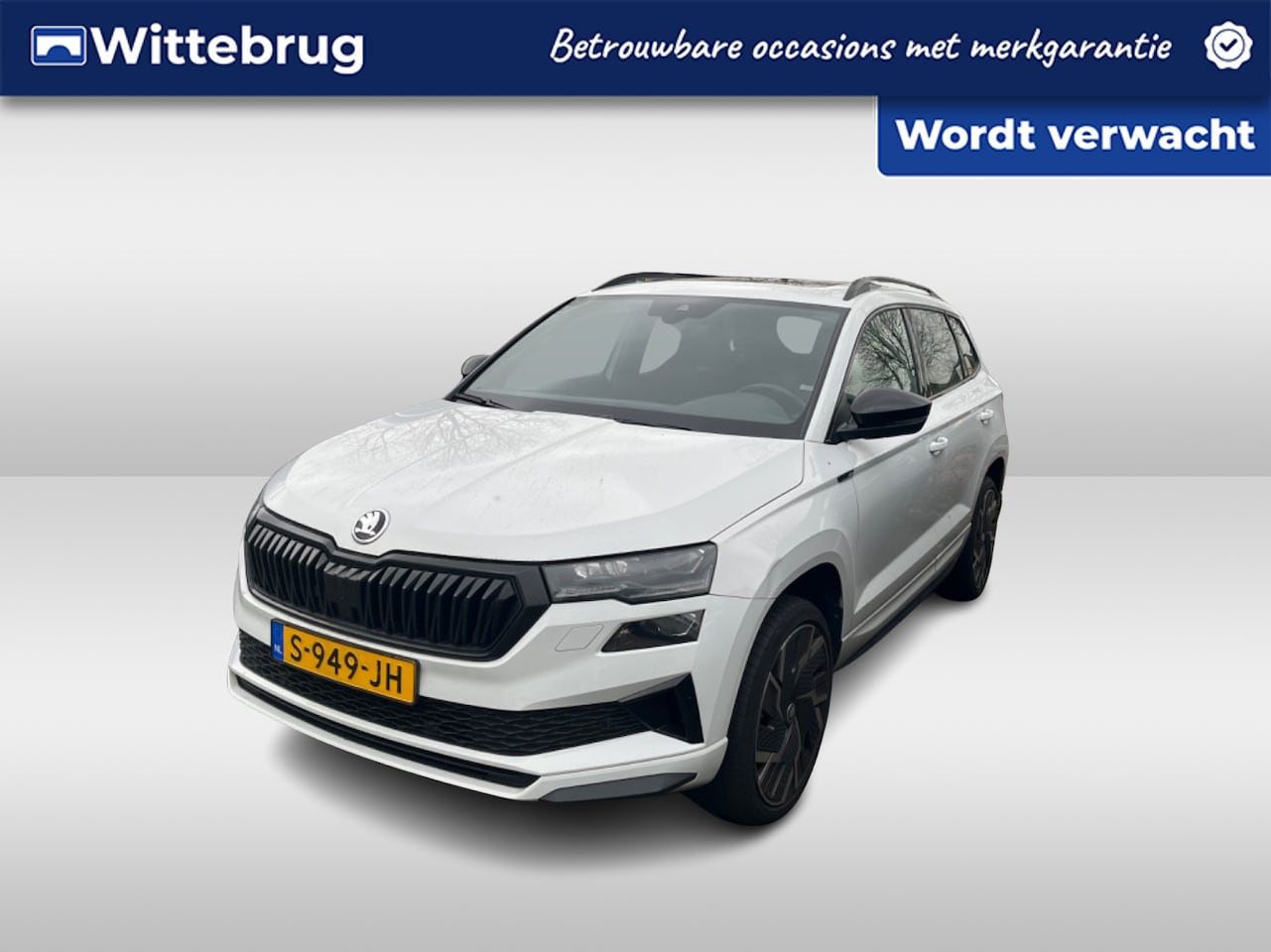 Skoda Karoq - 1.5 TSI ACT Sportline Business / Digitaal dashboard / Pano / Navigatie / App connect / Cam - AutoWereld.nl