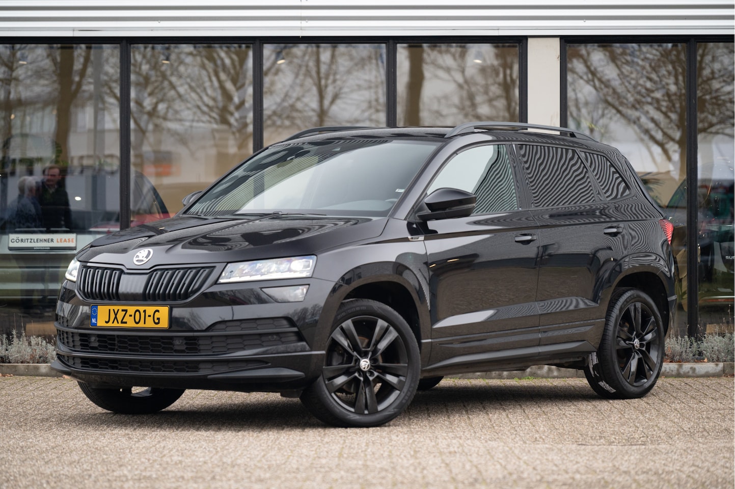 Skoda Karoq - 1.5 TSI ACT Sportline Business | ACC | Navi | Apple CarPlay | CANTON Audio | Camera - AutoWereld.nl
