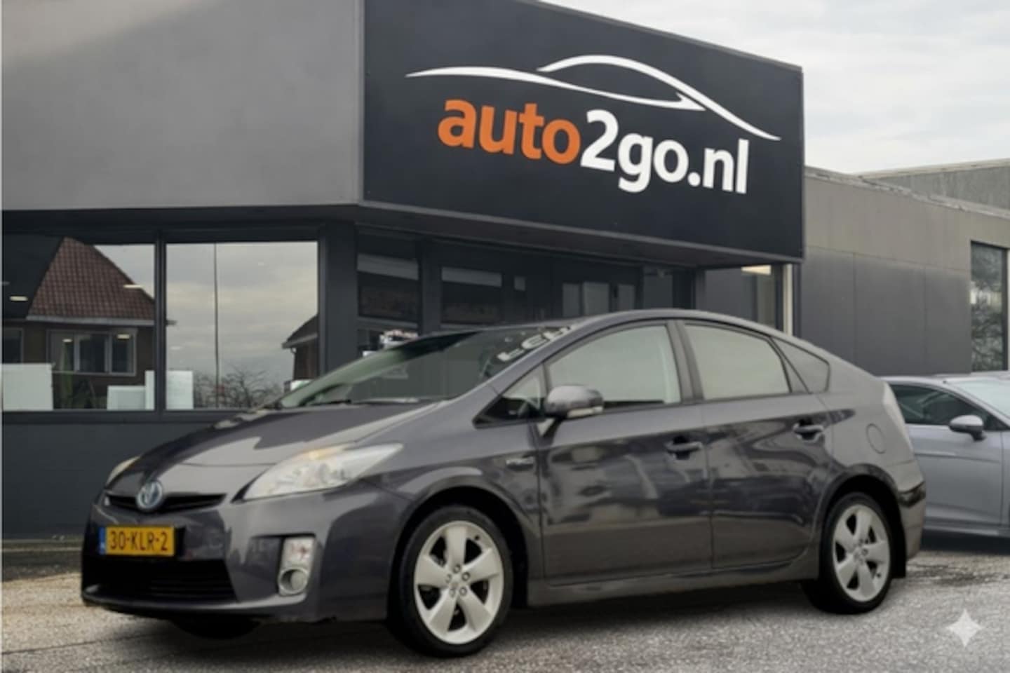Toyota Prius - 1.8 ASPIRATION AUT NAVI AIRCO HEAD-UPP LED LMV PDC - AutoWereld.nl