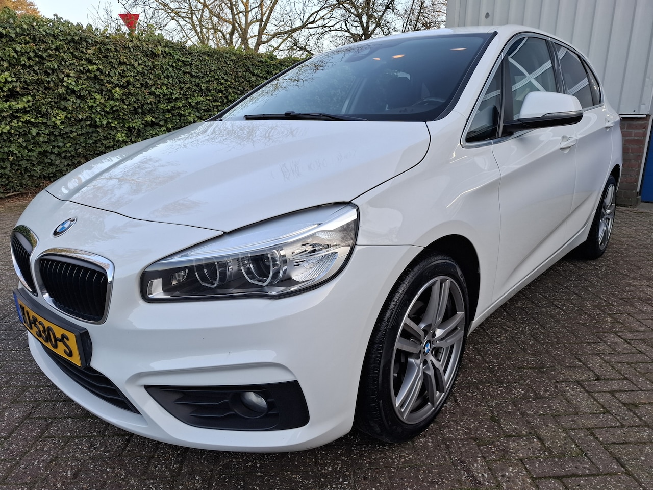 BMW 2-serie Active Tourer - 218i CLIMAT/CRUISE/NAVI/LED/TREKHAAK/PDC.A/LED 136PK - AutoWereld.nl