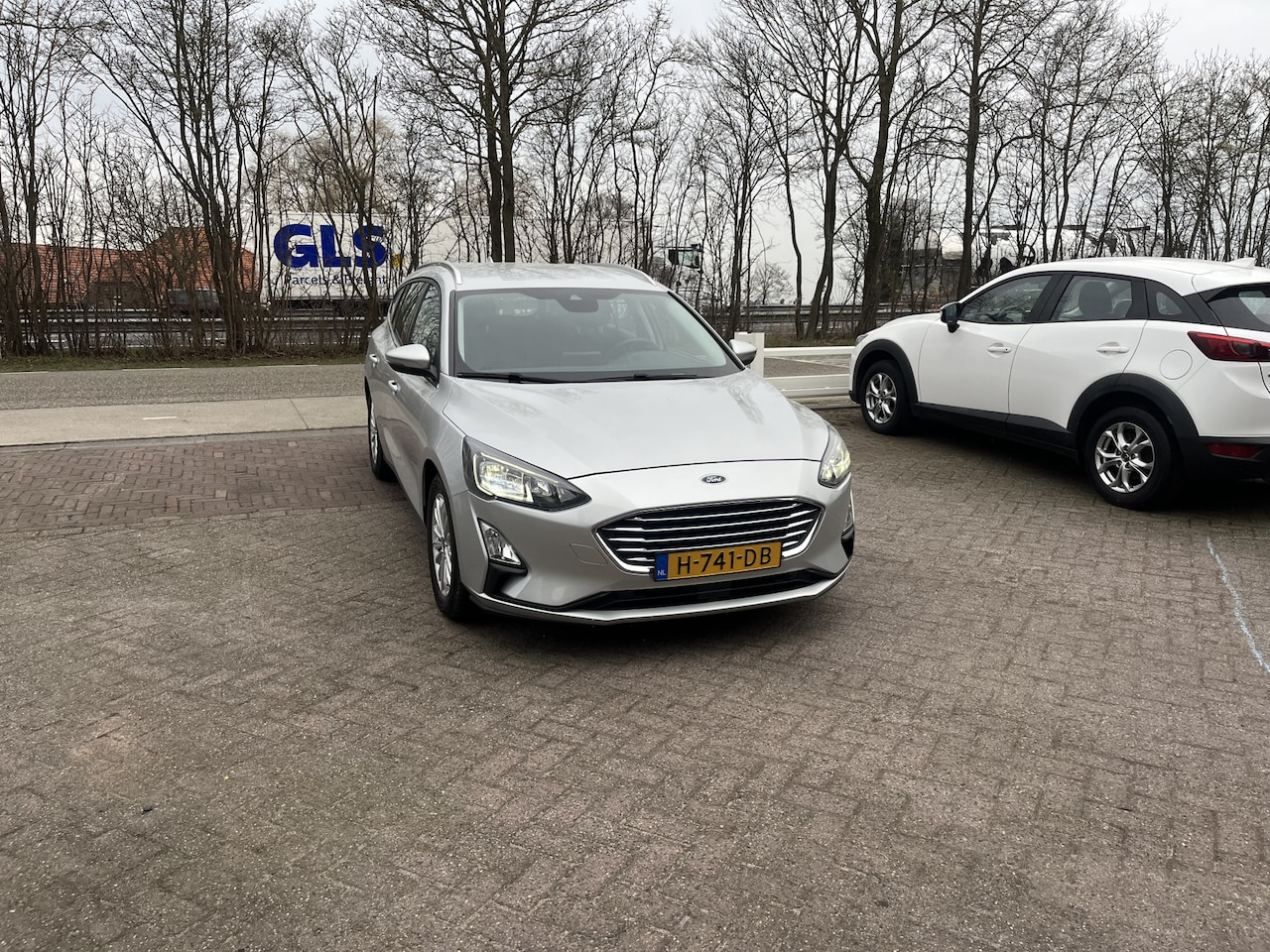Ford Focus Wagon - 1.0 EcoBoost Titanium Business TREKHAAK WINTER PACK STANDKACHEL B&O ADD CRUISE - AutoWereld.nl