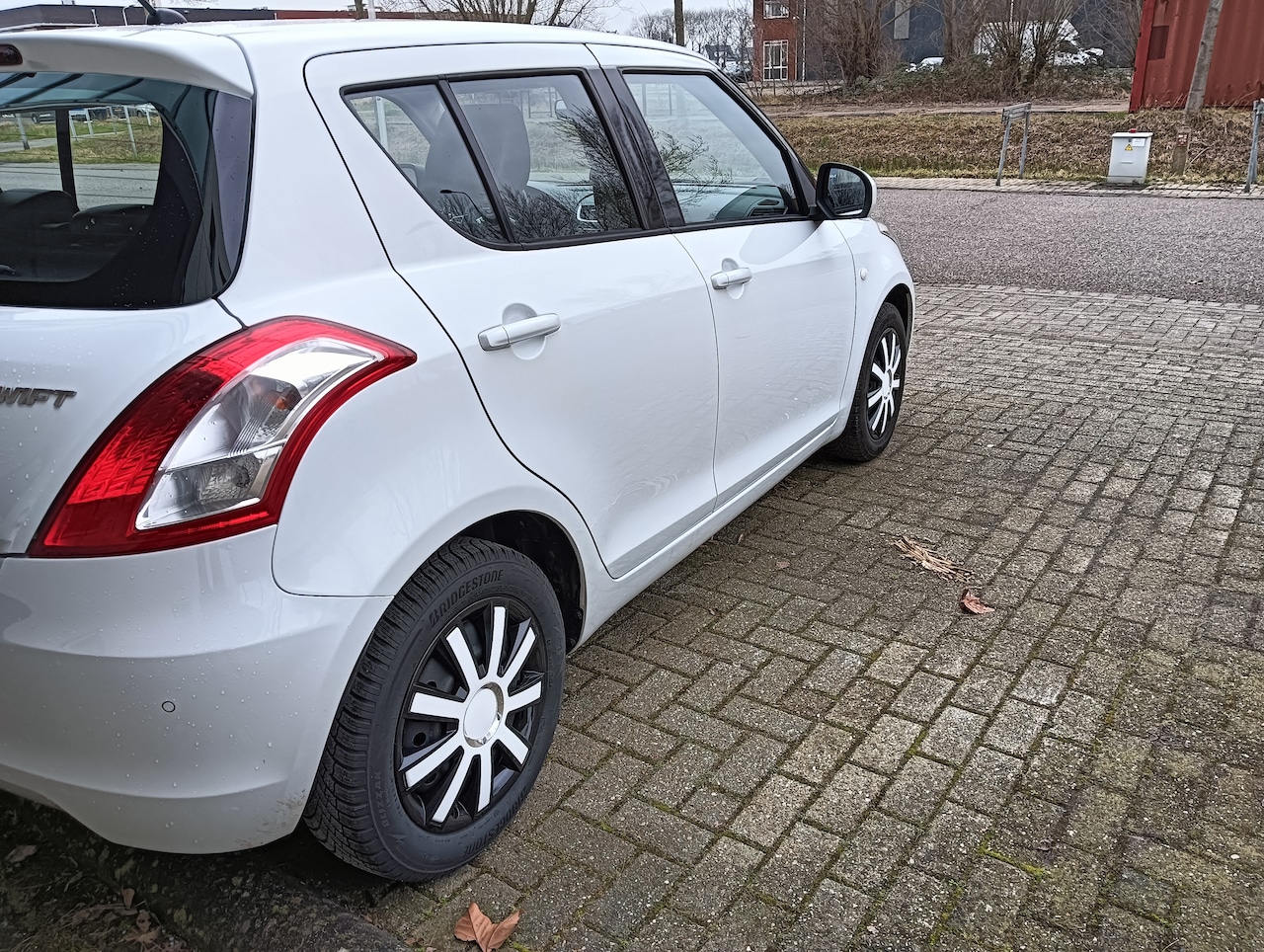 Suzuki Swift - Style. Airco. Cruise control . Kilometerstand 79700. - AutoWereld.nl