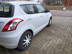 Suzuki Swift - 1.2 Exclusive Style. Airco. Cruise control . Kilometerstand 79700.
