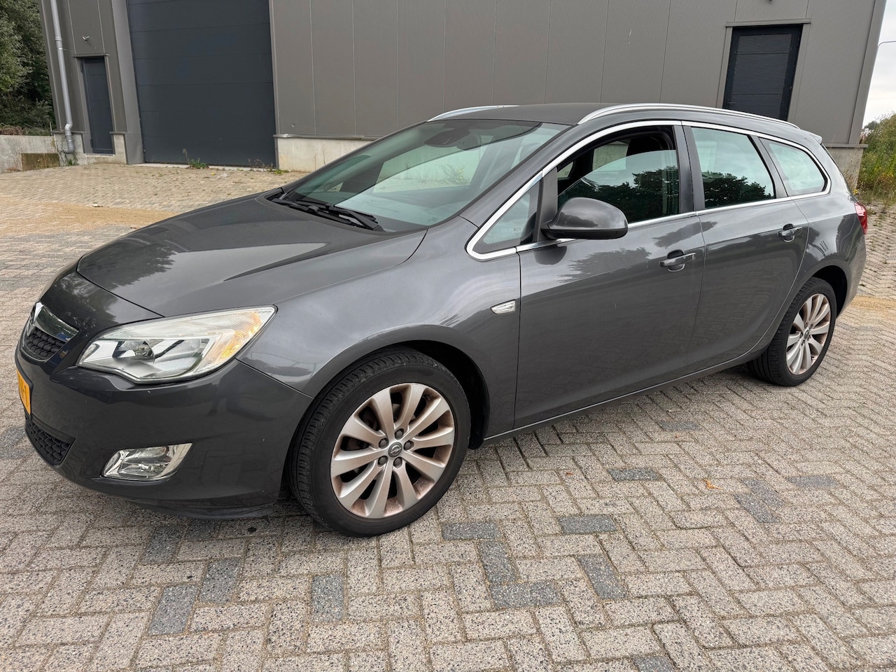 Opel Astra Sports Tourer - 1.4 Cosmo Navi cruiseC Clima - AutoWereld.nl