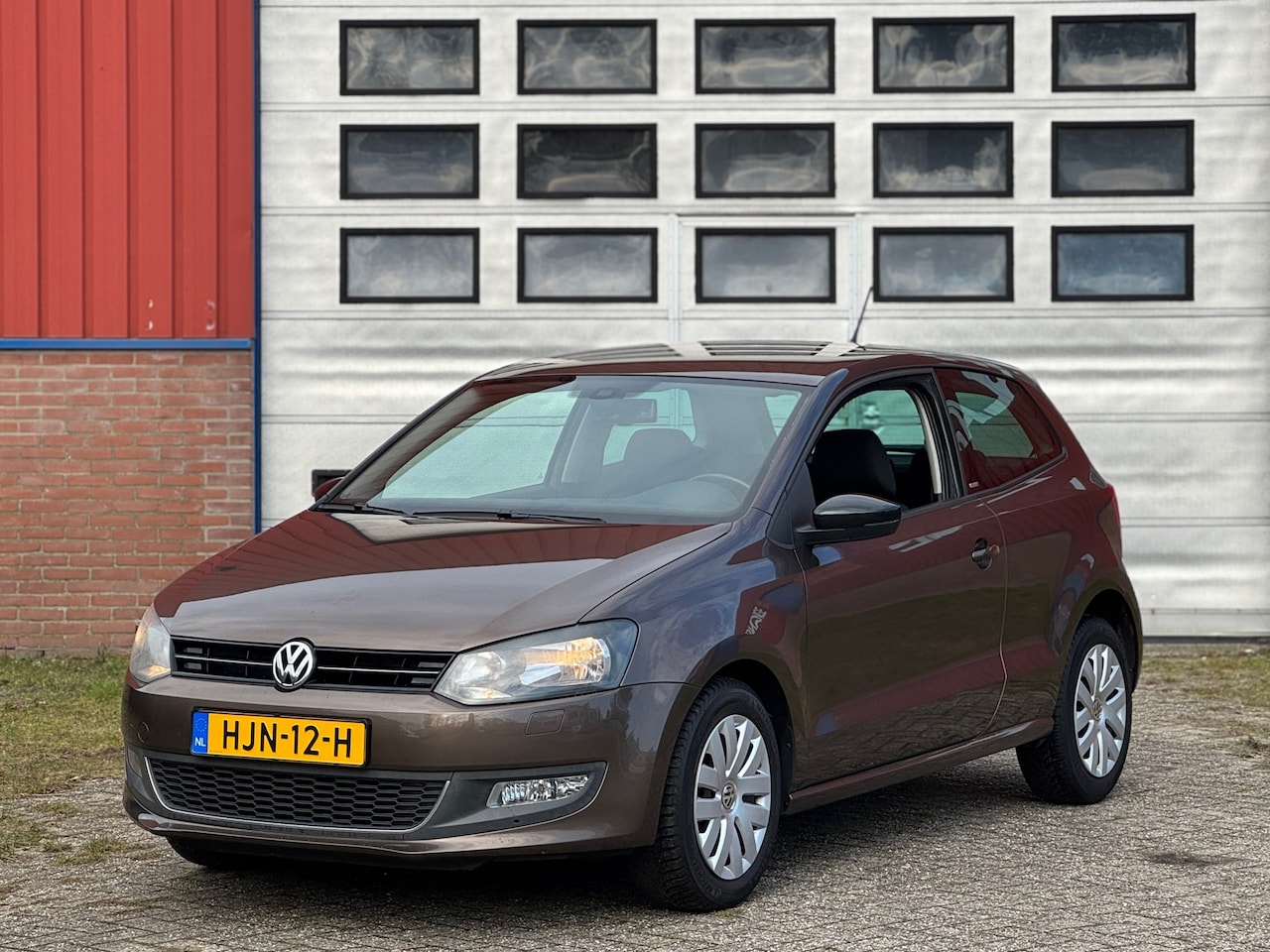 Volkswagen Polo - 1.2 Style 2011 51Kw Bruin Stoelverwarming Cruise Zeer netjes - AutoWereld.nl